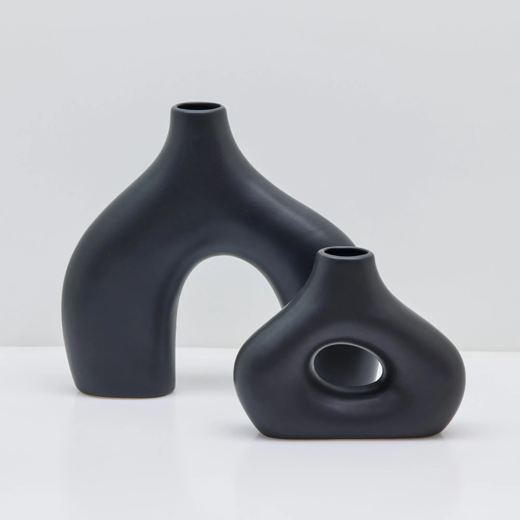 Sleek Black Stone Age-Inspired Arch Vase