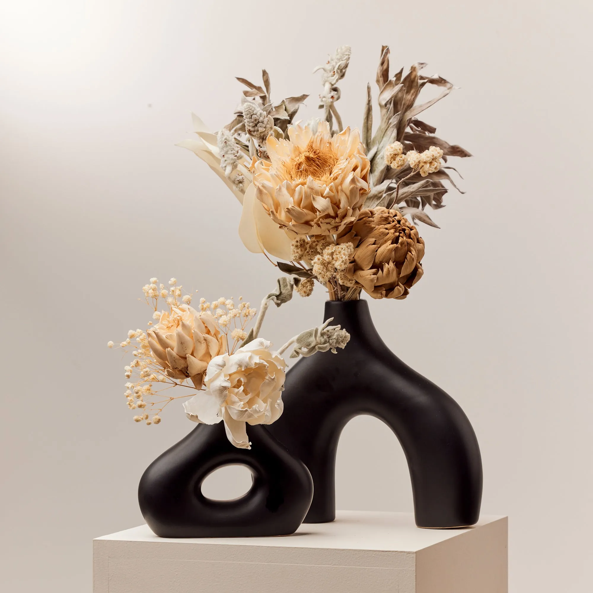 Sleek Black Stone Age-Inspired Arch Vase